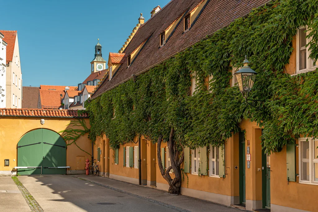 Ivy-covered rowhouses in the Fuggerei, Augsburg.