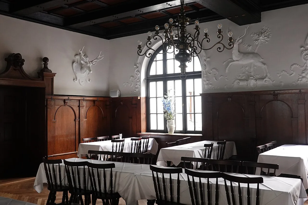 Tables set in the White Hall dining room of Augustiner-Bräu, Munich.