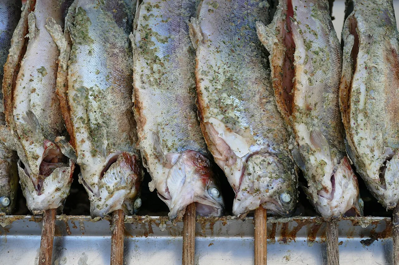Steckerlfisch, Bavarian grilled fish on sticks, at the Auer Maidult market in Munich.