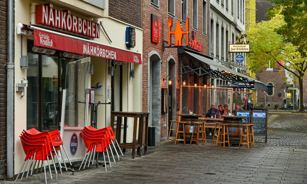 Bars with outdoor seating on a street in the old town, Düsseldorf.