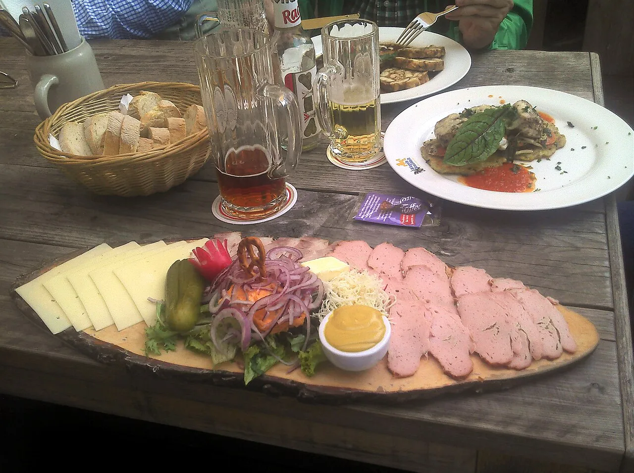 A Brotzeit platter of cold cuts and cheese with beer at Braumeister Müller's, Augsburg.