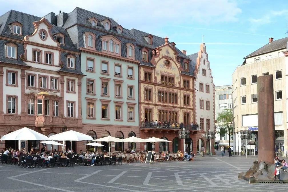 Café umbrellas on a square in the old town of Mainz.
