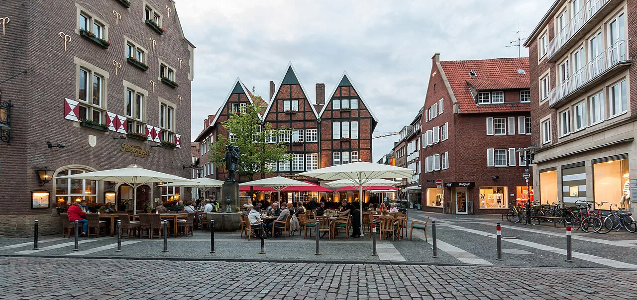 Restaurant terraces around the Kiepenkerl monument at Spiekerhof, Münster.