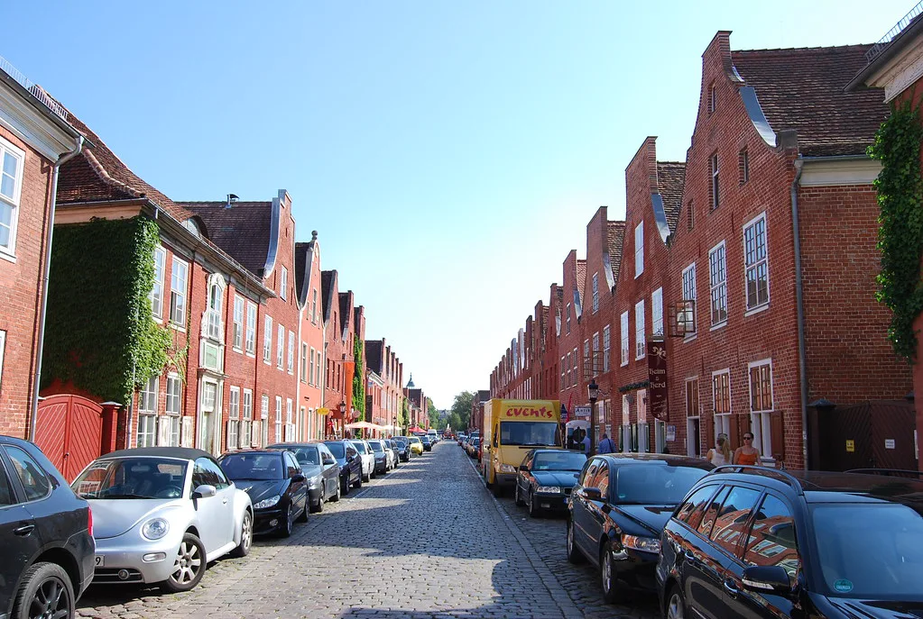 Red-brick townhouses on a street in central Potsdam.