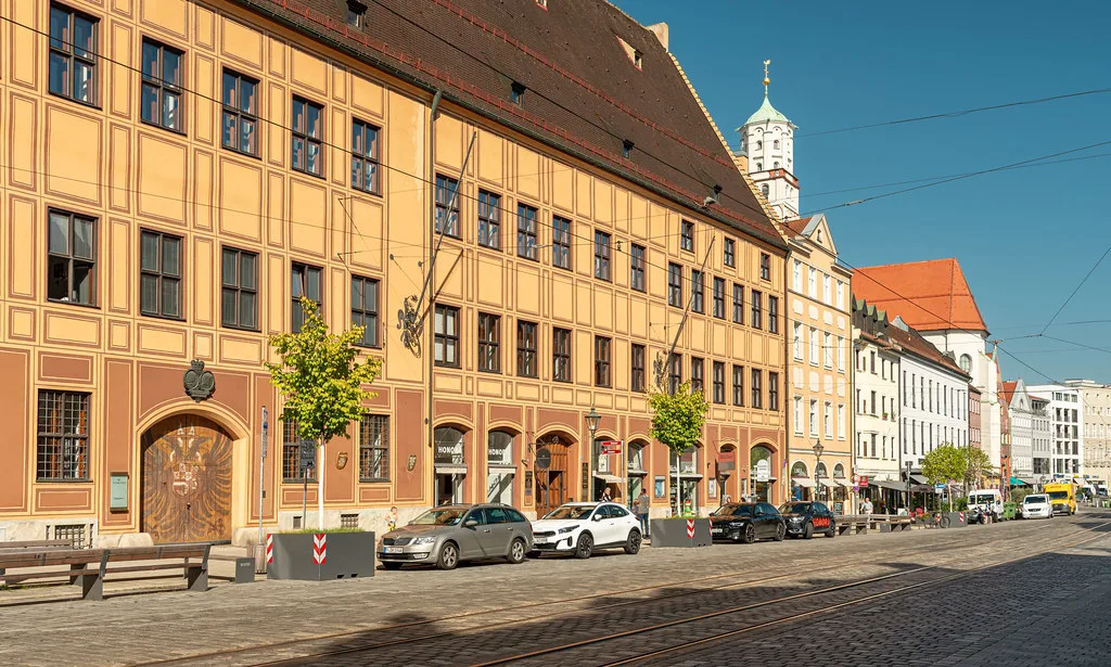 Historic buildings along a street in central Augsburg.