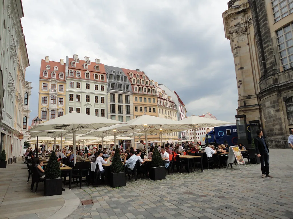 Sidewalk café tables on the Neumarkt in Dresden's old town.