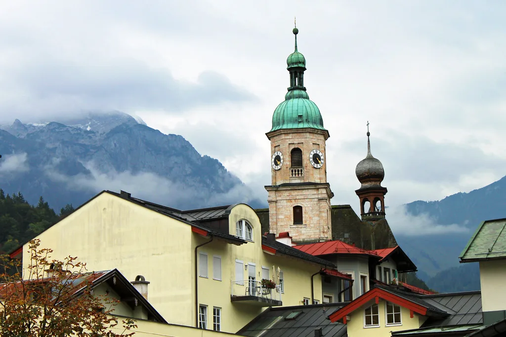 Berchtesgaden's church towers below the Alps.