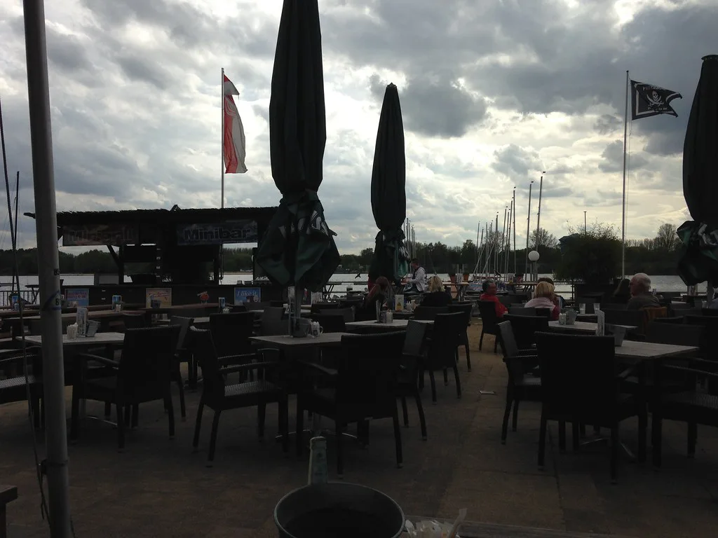 Outdoor restaurant tables under parasols, Düsseldorf.