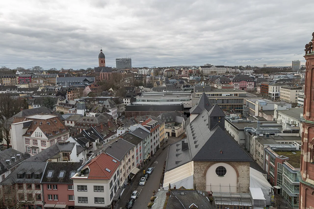 Rooftops and a church tower in central Mainz seen from above.