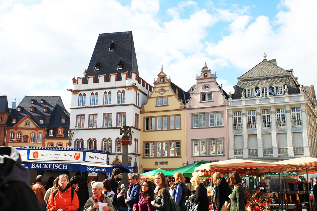 Market stalls and shoppers on the Hauptmarkt, Trier.