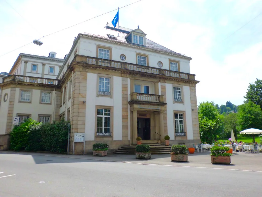 A historic building with flags in Baden-Baden.