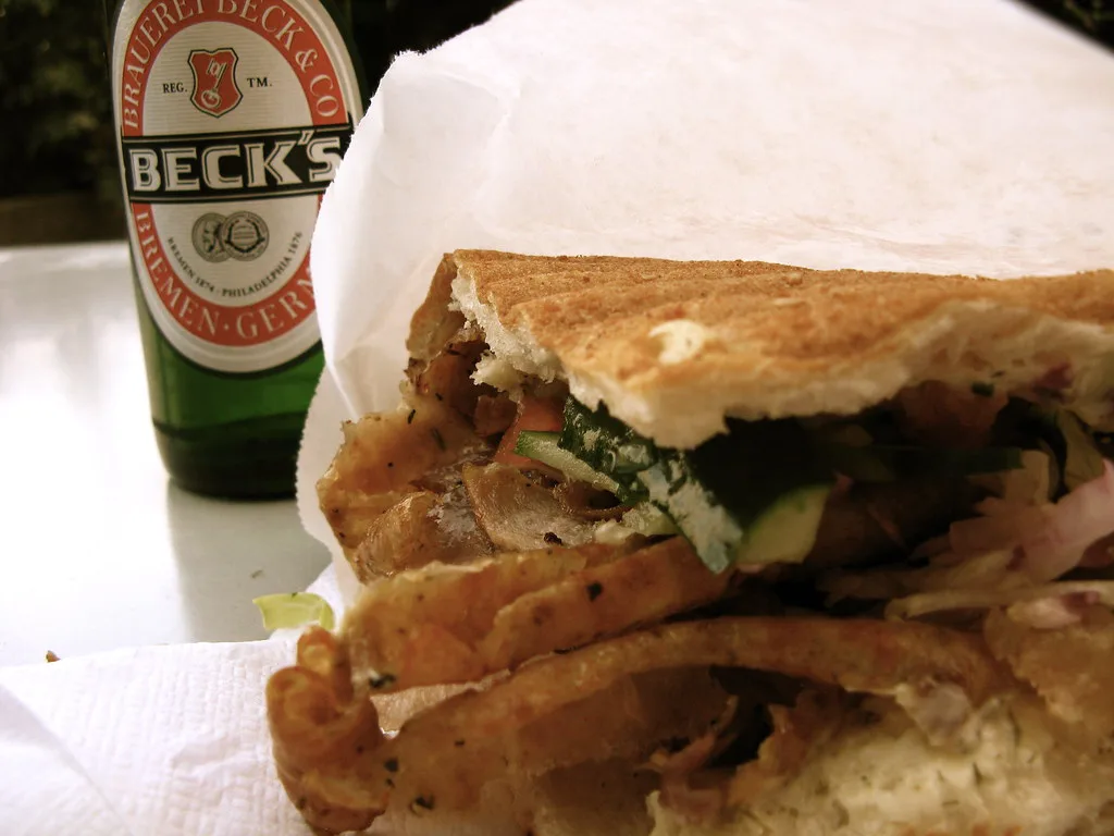 A döner kebab with a bottle of Beck's beer, Berlin.