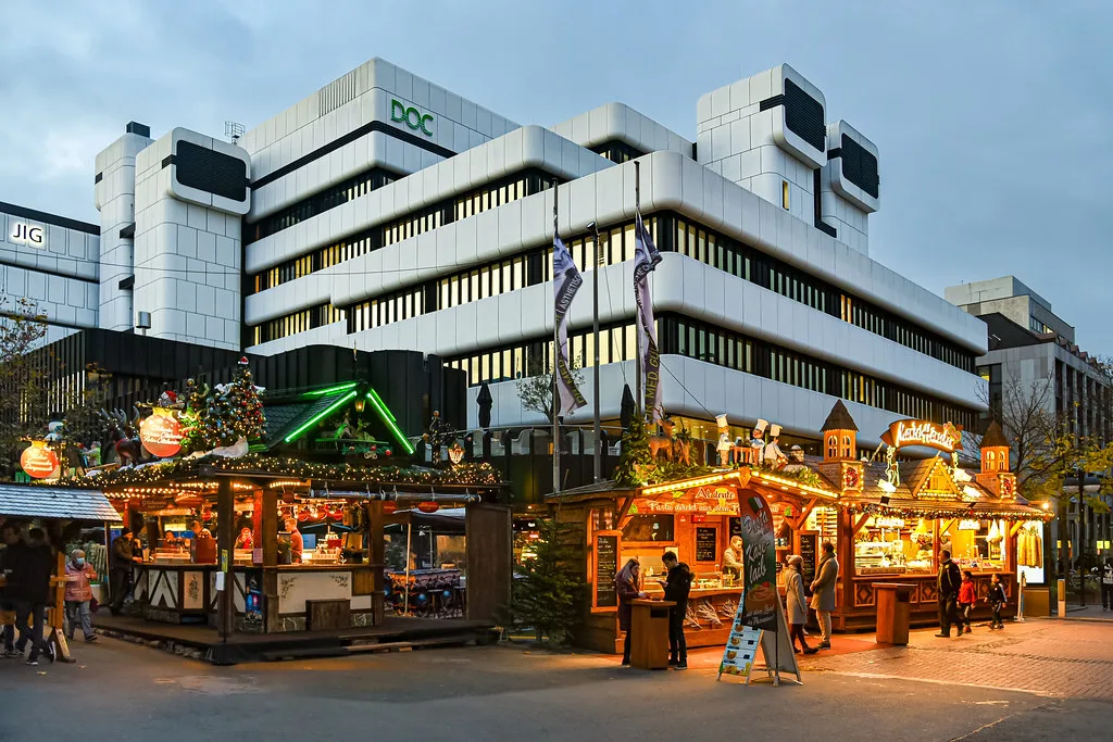 Christmas market stalls in front of modern office buildings, Dortmund.