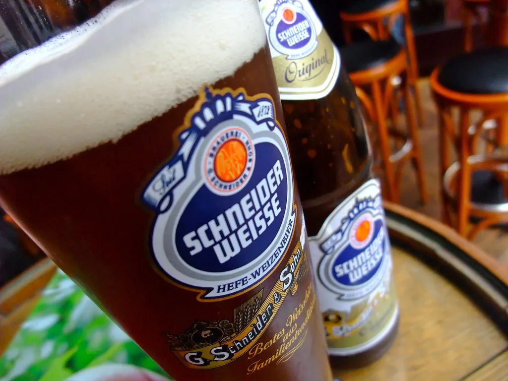 A glass of Schneider Weisse dark wheat beer.
