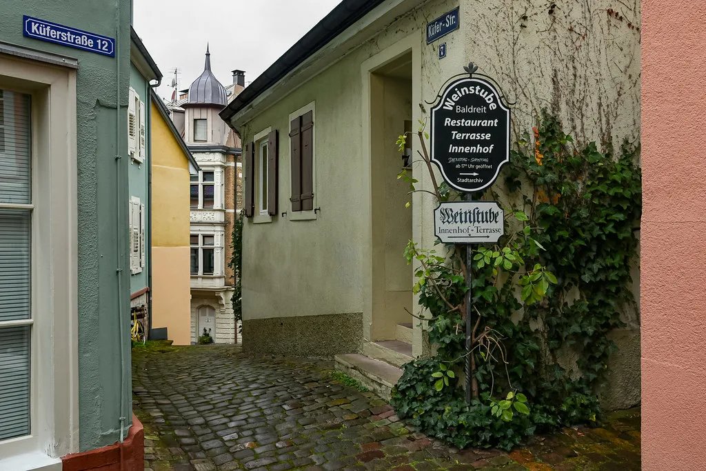 A restaurant sign in a narrow lane of Baden-Baden's old town.