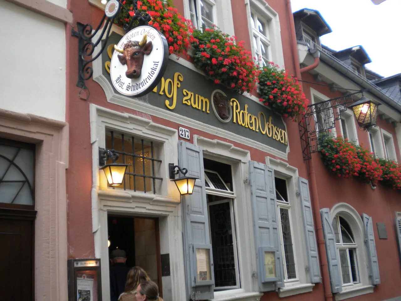 Entrance and sign of the Zum Roten Ochsen inn in Heidelberg.