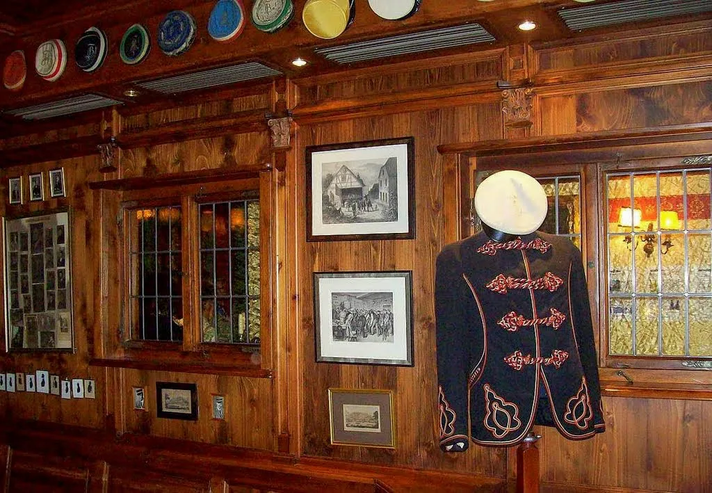Wood-paneled Mensurstube dining room at the historic Hirschgasse inn, Heidelberg.
