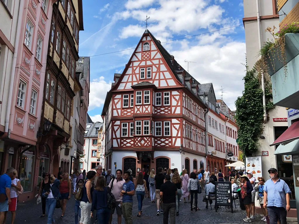 A half-timbered house on a busy old town street, Mainz.