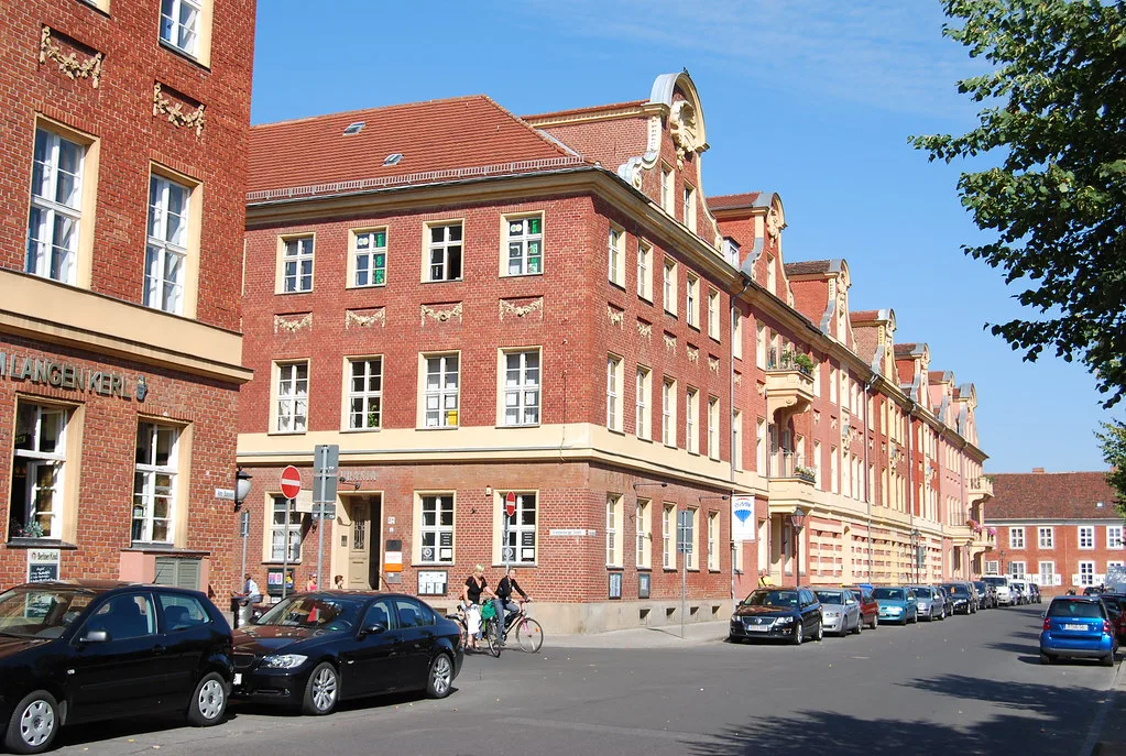 Red-brick buildings on a street in central Potsdam.