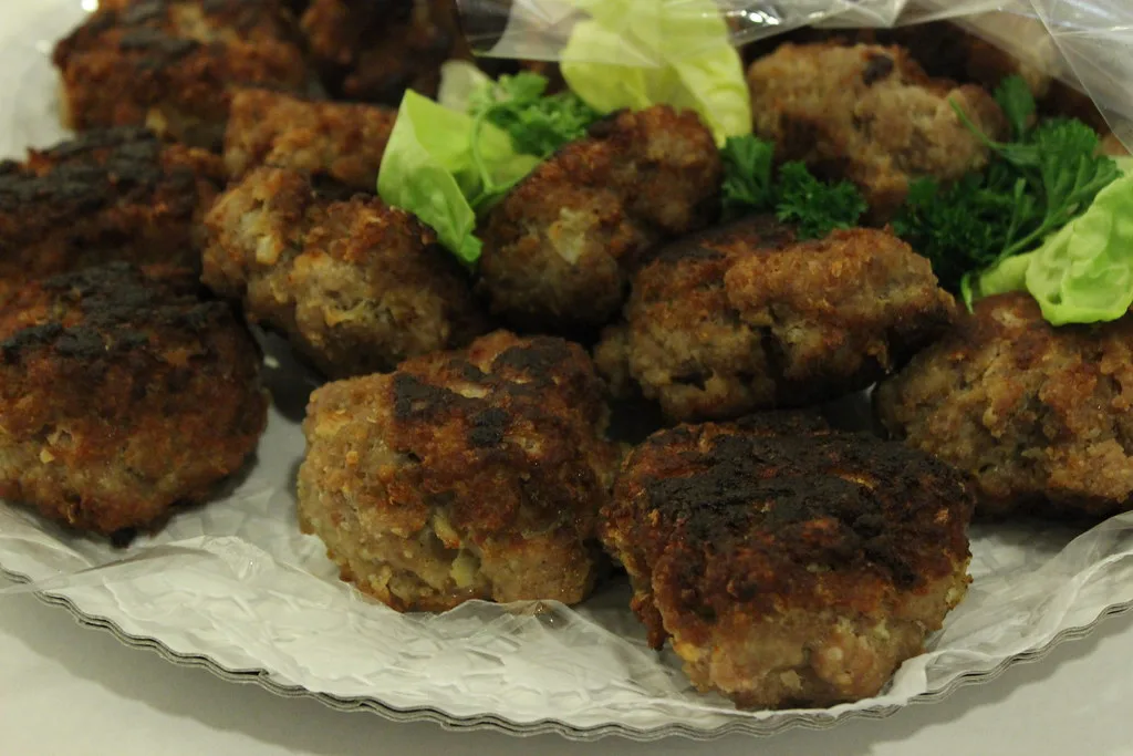 A platter of freshly fried frikadellen on lettuce, Düsseldorf.