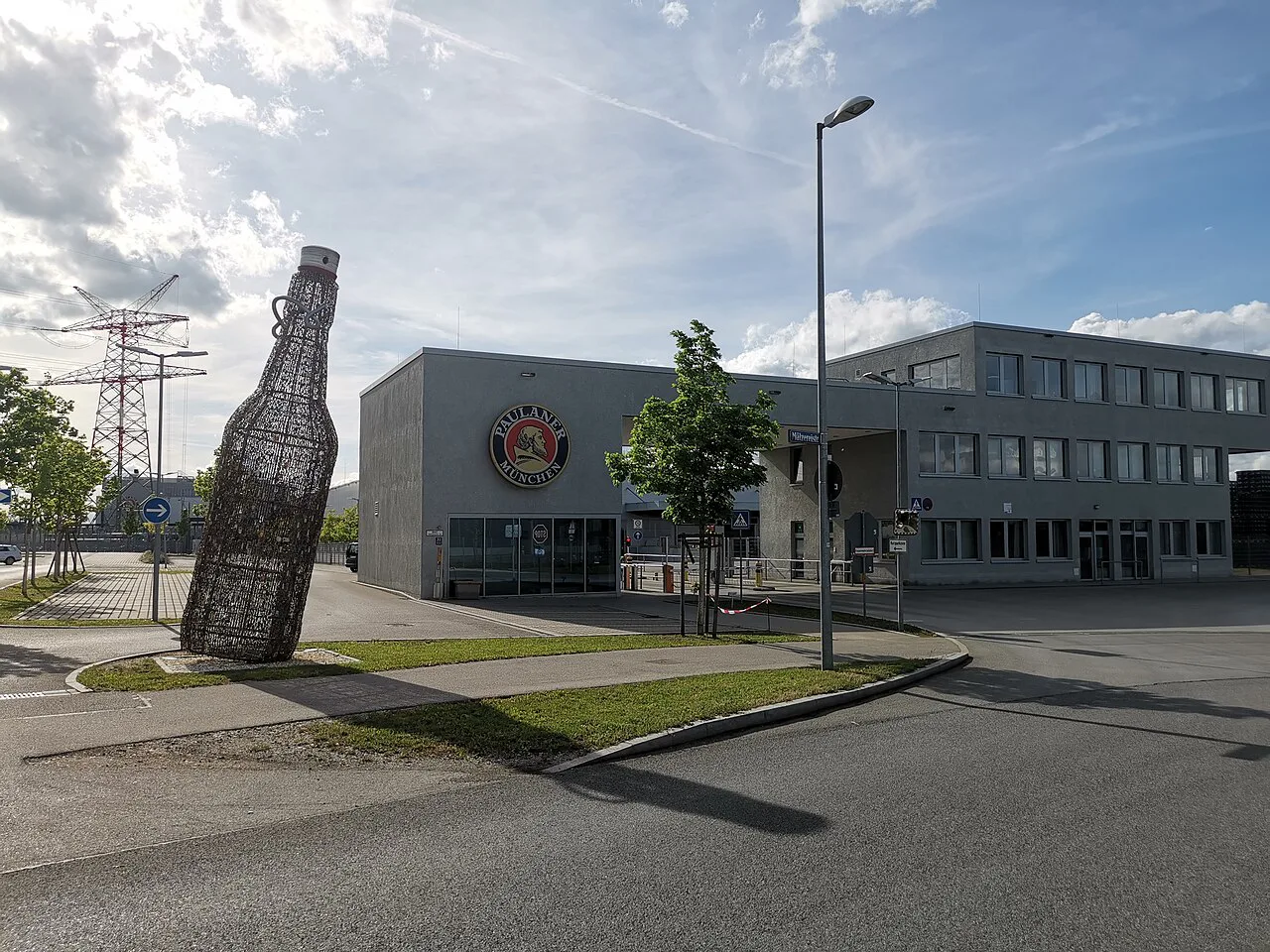 The Paulaner brewery in Munich, with a giant bottle sculpture at the entrance.
