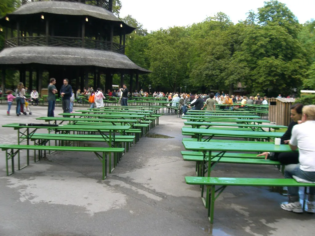 Long beer garden benches by the Chinese Tower in Munich's English Garden.