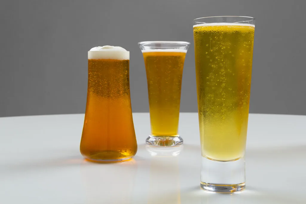 Three beers in different glass shapes.