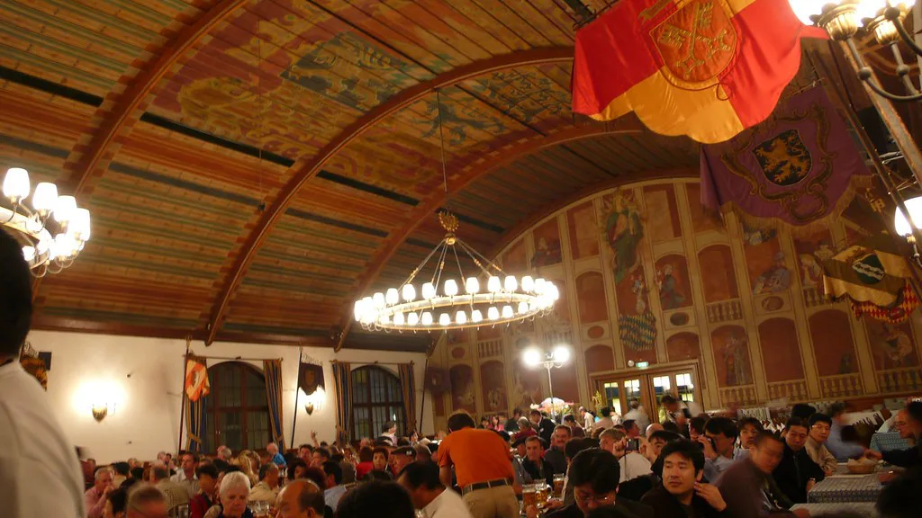 Drinkers under the painted vaults of the Hofbräuhaus beer hall, Munich.