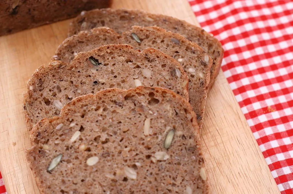 Slices of German rye bread on a board.