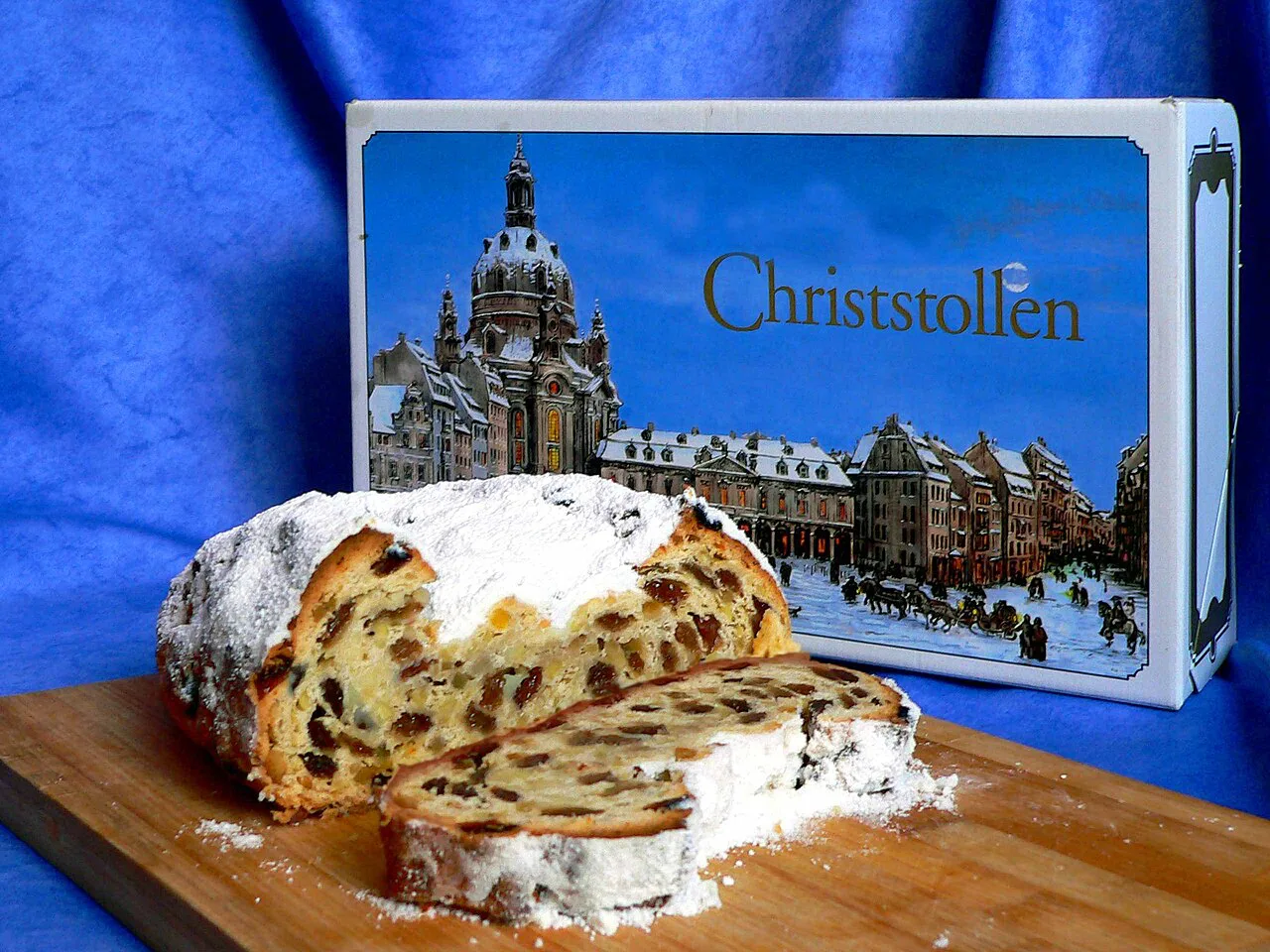 A sliced Dresdner Christstollen dusted with powdered sugar.