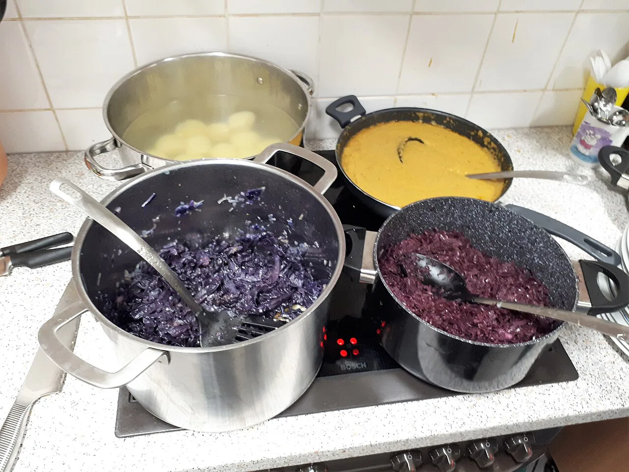 Red cabbage and potato dumplings cooking for a Christmas goose dinner.