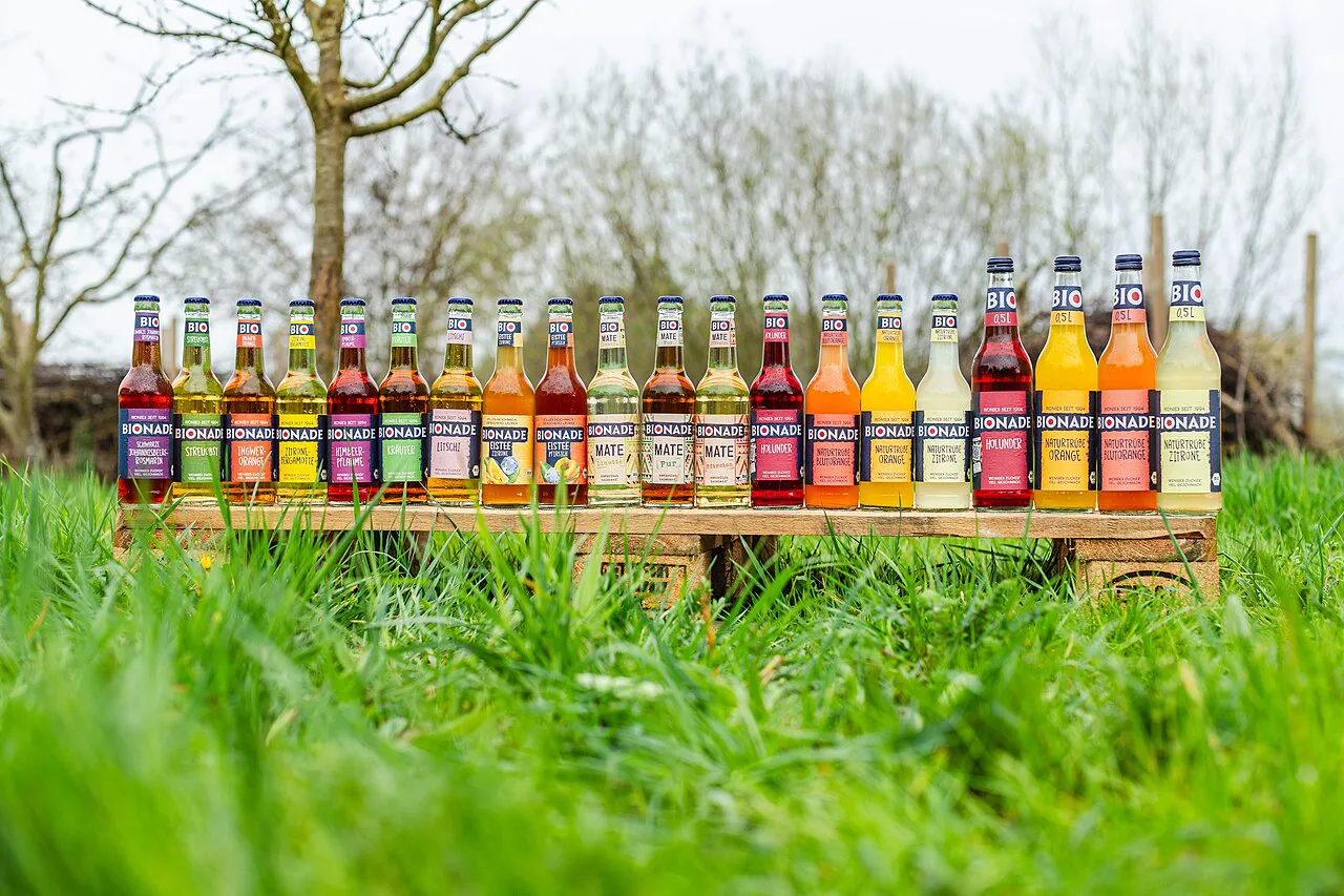 A row of Bionade organic soda bottles in different flavors.