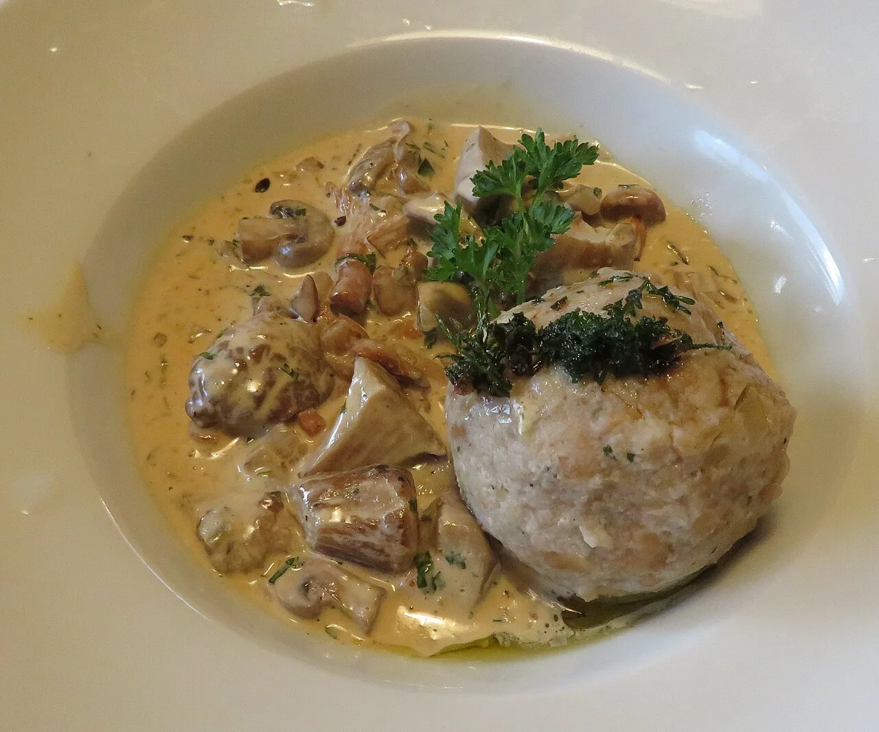 A Semmelknödel bread dumpling with mushroom ragout.