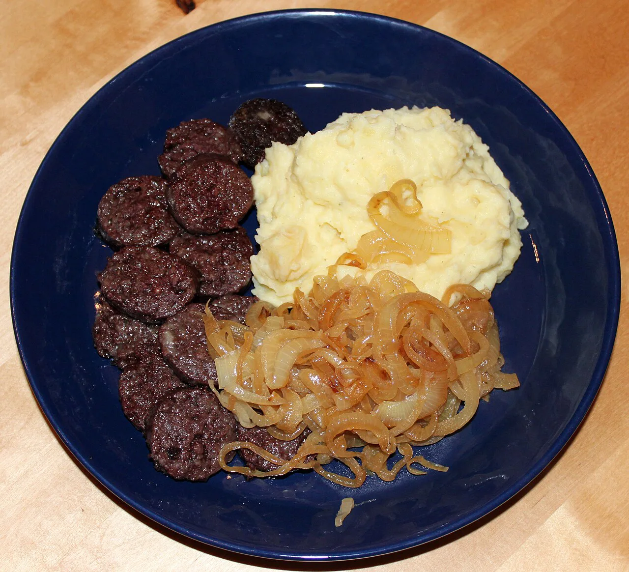 Himmel und Erde with black pudding, fried onions and mashed potatoes.