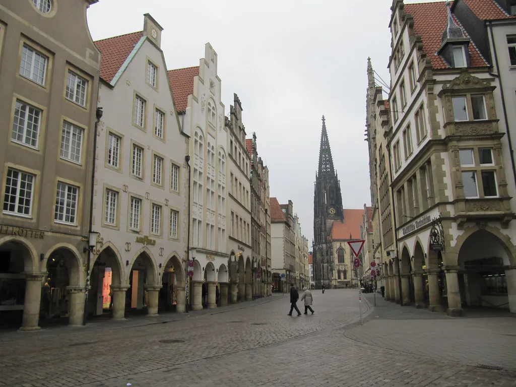 Arcaded gabled houses on the Prinzipalmarkt with St. Lambert's Church, Münster.