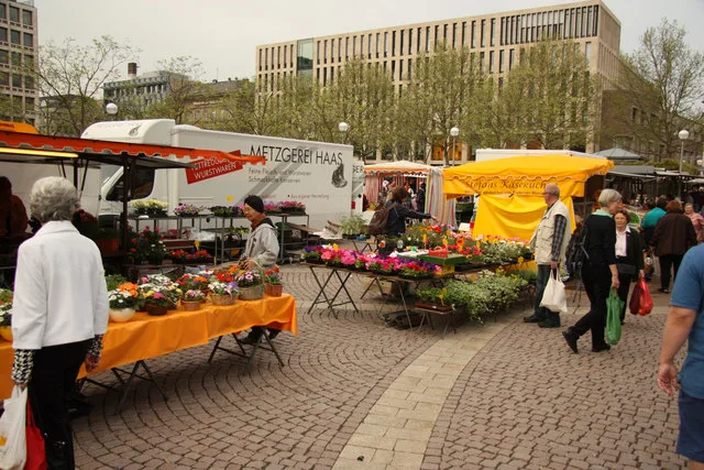 Market stalls with flowers and produce on Marktplatz, Wiesbaden.