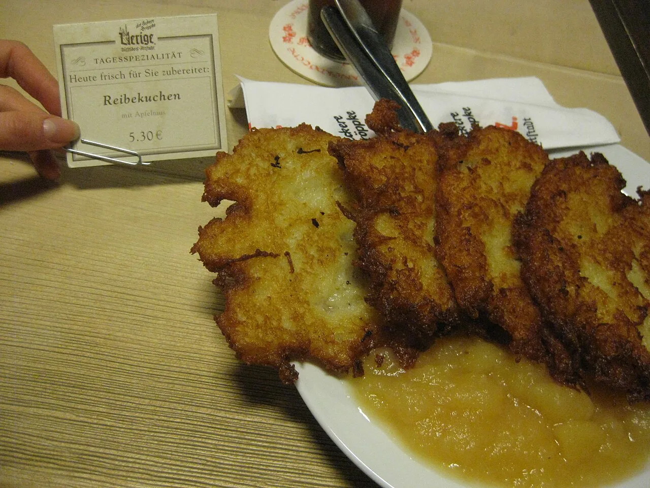 Reibekuchen served with apple sauce.