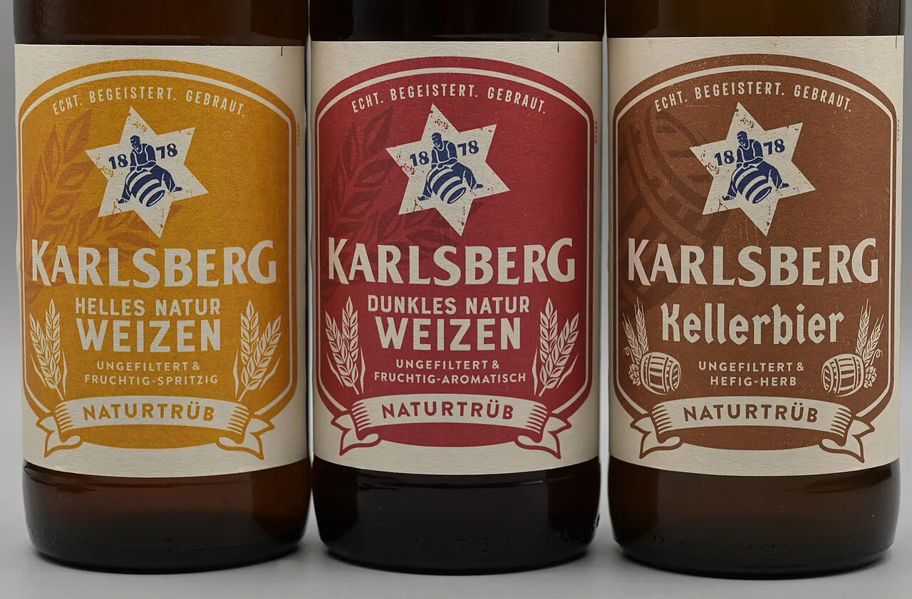 Karlsberg Kellerbier bottled beside the brewery's wheat beers.