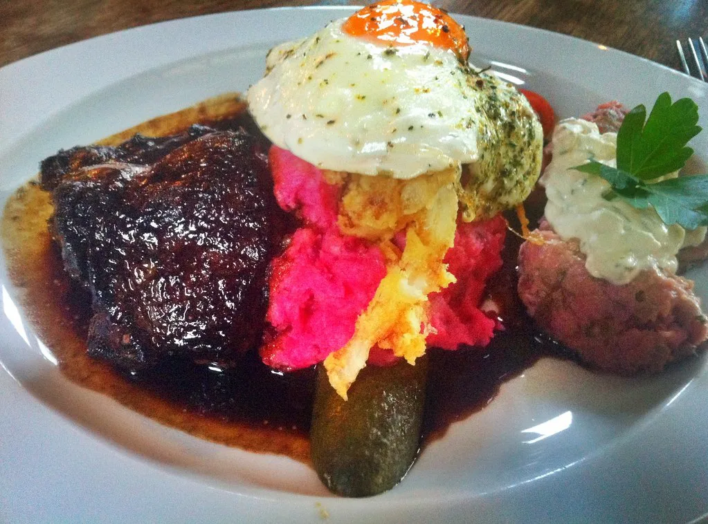 Labskaus with a fried egg, beetroot and a pickle at the Strandhalle in Binz.