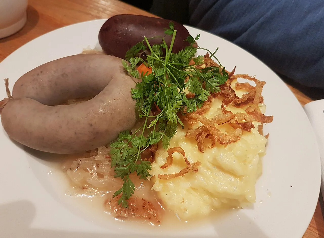 Hot blood sausage and liver sausage with sauerkraut, mashed potatoes and roasted onions at Weisses Brauhaus.