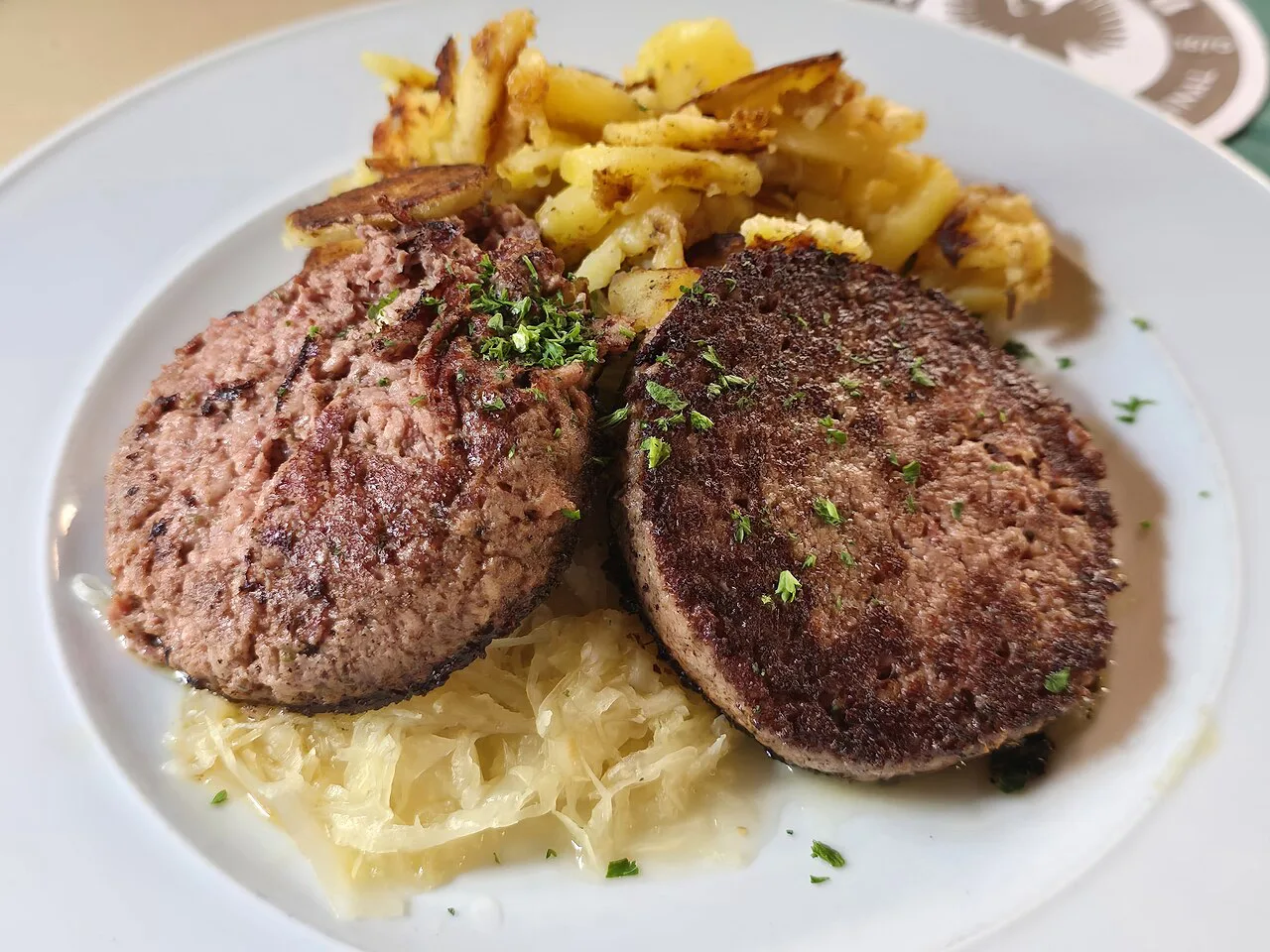 Fried liver sausage with sauerkraut and fried potatoes at Mahrs Bräu, Bamberg.
