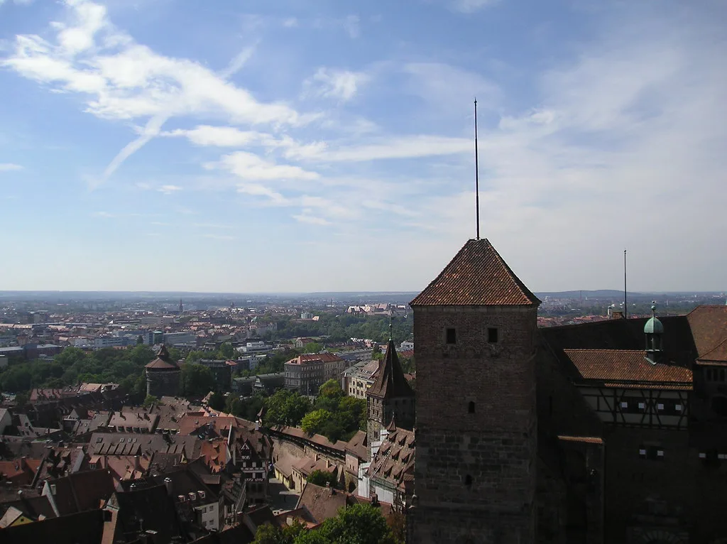 A tower of Nuremberg Castle above the city rooftops.