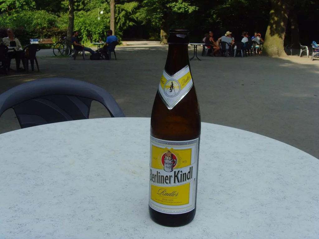 A bottle of Berliner Kindl Radler on a beer-garden table in Berlin.
