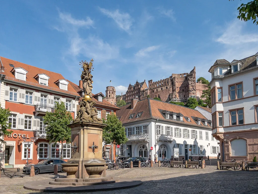 Heidelberg Castle above the Kornmarkt and its Madonna statue, Heidelberg.