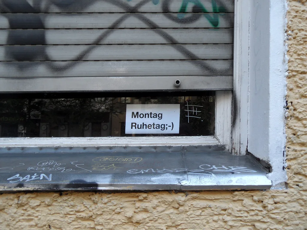 A Montag Ruhetag sign in a shuttered window, Berlin.