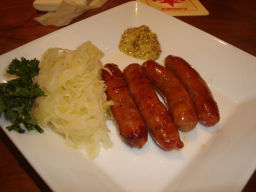 Grilled sausages with sauerkraut and wholegrain mustard.