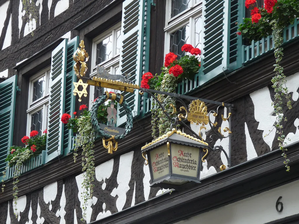 The hanging sign and flower boxes of Zum Schlenkerla, Bamberg.