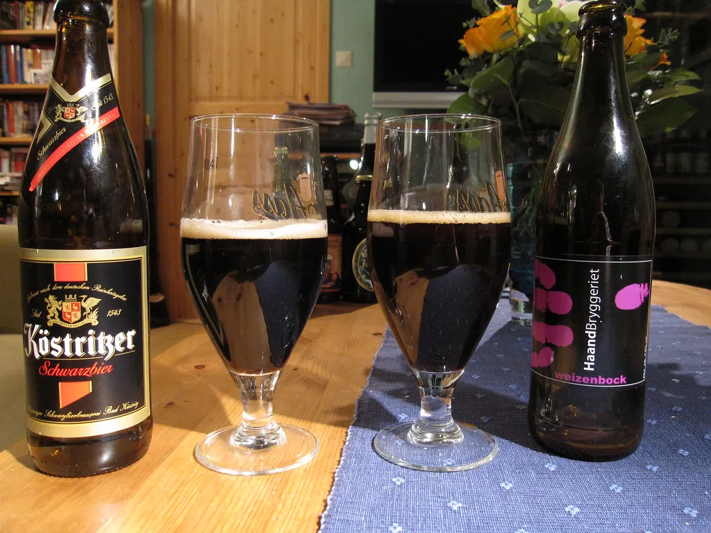 A bottle of Köstritzer Schwarzbier poured beside a second German beer.