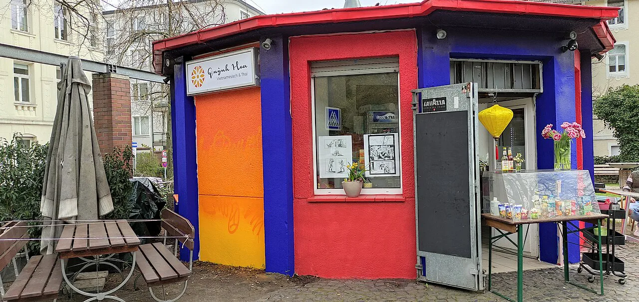 Colorfully painted snack kiosk on Ungarnplatz, Aachen.