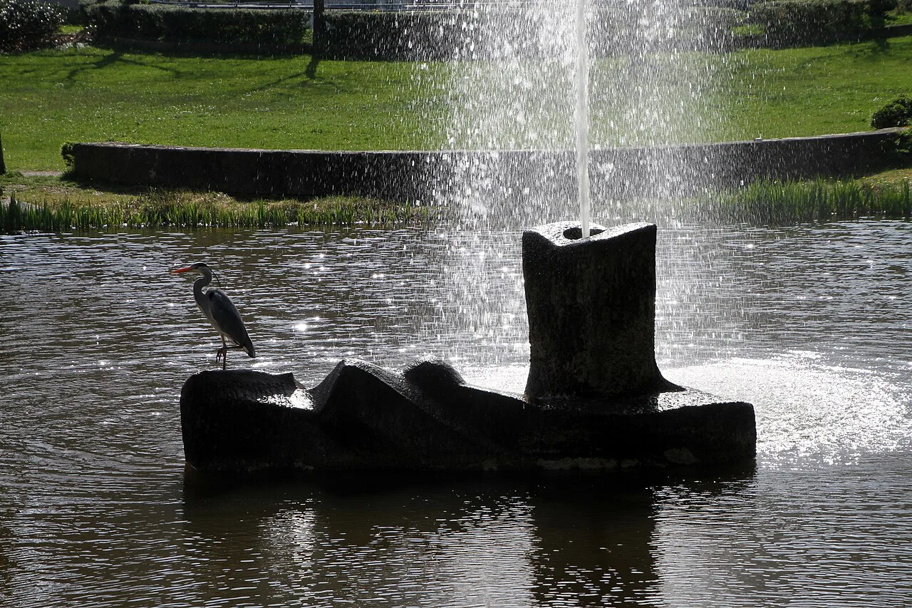 Fountain with a gray heron in the Berlioz park beside the Festspielhaus, Baden-Baden.